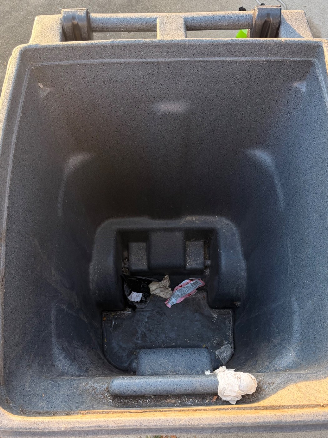 Dirty trash bin before cleaning